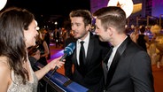 Darude und Sebastian Rejman auf dem Orange Carpet in Tel Aviv mit Alina Stiegler. © Claudia Timmann 