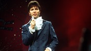 Cliff Richard tritt am 6. April 1968 beim Eurovision Song Contest in London auf. © Picture-Alliance / dpa 